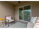 Cozy balcony with comfortable furniture, perfect for relaxation and enjoying the outdoor scenery at 9433 Randal Park Blvd, Orlando, FL 32832