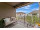 Inviting balcony with comfortable seating and a view of the lush surroundings at 9433 Randal Park Blvd, Orlando, FL 32832