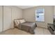 Bedroom with neutral color palette, carpet, natural light, tv, and standard closet at 9433 Randal Park Blvd, Orlando, FL 32832
