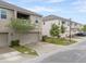 Modern townhomes with private garages, balconies, and well-manicured landscaping at 9433 Randal Park Blvd, Orlando, FL 32832