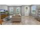 Spacious living room featuring a comfortable sectional sofa, tile flooring, and natural light at 9433 Randal Park Blvd, Orlando, FL 32832