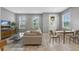 Cozy living room featuring tile floors, ample natural light, and neutral walls at 9433 Randal Park Blvd, Orlando, FL 32832