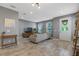 Modern living room complete with a large sectional, stylish tile flooring, and plenty of natural light at 9433 Randal Park Blvd, Orlando, FL 32832