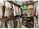 Spacious walk-in closet with wire shelving, rods for hanging clothes, and designated shoe storage at 9433 Randal Park Blvd, Orlando, FL 32832