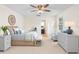 Cozy bedroom with ceiling fan, lots of natural light, and neutral decor at 25929 Newcombe Cir, Leesburg, FL 34748