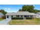 Charming single-story home with well-manicured lawn and established landscaping at 25929 Newcombe Cir, Leesburg, FL 34748