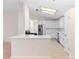 Spacious kitchen with stainless steel appliances and white cabinetry at 25929 Newcombe Cir, Leesburg, FL 34748
