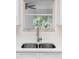 Kitchen sink with a view of the outdoors at 25929 Newcombe Cir, Leesburg, FL 34748