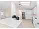 Spacious kitchen with white countertops, stainless steel appliances, and a sunlit atmosphere at 25929 Newcombe Cir, Leesburg, FL 34748