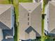 Aerial view of the home's roof showing the shape, vents, and relation to the neighboring properties at 669 Big Pine Ave, Minneola, FL 34715