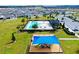An aerial view showcasing the community playground, pool, and clubhouse in a Gathering-friendly setting at 669 Big Pine Ave, Minneola, FL 34715