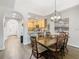 Bright dining area connects to the kitchen with archways and features wood-style flooring at 9051 Treasure Trove Ln # 405, Kissimmee, FL 34747