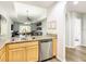 Modern kitchen featuring granite countertops, stainless steel appliances, and an open floor plan at 9051 Treasure Trove Ln # 405, Kissimmee, FL 34747
