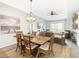 Open living space with dining area, a ceiling fan, and stylish decor at 9051 Treasure Trove Ln # 405, Kissimmee, FL 34747