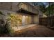 View of a backyard patio with sliding glass doors and a second story balcony at 503 Moree Loop, Winter Springs, FL 32708
