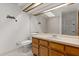 Bathroom featuring a skylight above the shower and a wood vanity at 503 Moree Loop, Winter Springs, FL 32708