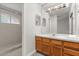 Bathroom featuring a large vanity, sink, mirror, and walk-in shower at 503 Moree Loop, Winter Springs, FL 32708