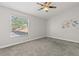 Bedroom with a window and dinosaur themed wall decor at 503 Moree Loop, Winter Springs, FL 32708
