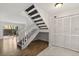 Bright entryway showcasing a staircase and closet with hard surface flooring at 503 Moree Loop, Winter Springs, FL 32708