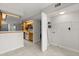 Open concept kitchen with a laundry closet including shelving and hookups at 503 Moree Loop, Winter Springs, FL 32708