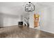 Spacious living room with fireplace, staircase, and view into the kitchen at 503 Moree Loop, Winter Springs, FL 32708