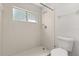 White tiled walk-in shower with glass window and shower head at 503 Moree Loop, Winter Springs, FL 32708
