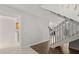 View of an interior staircase next to a kitchen and living room at 503 Moree Loop, Winter Springs, FL 32708