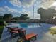 A community pool with lounge chairs at 5421 Watervista Dr, Orlando, FL 32821