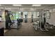 A community gym with multiple cardio machines, weights, and an open floor plan at 5421 Watervista Dr, Orlando, FL 32821