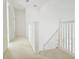 Well-lit hallway with carpeted floor and white walls at 5421 Watervista Dr, Orlando, FL 32821