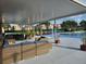 Beautiful community pool with ample seating, a covered area, and mature landscaping at 5421 Watervista Dr, Orlando, FL 32821