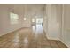 Bright living room featuring neutral tile flooring, a chandelier, and sliding doors to the outdoor area at 5421 Watervista Dr, Orlando, FL 32821