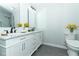 Bathroom featuring dual sinks, marble countertop and updated light fixtures at 7584 Lodge Pole Trl, Winter Park, FL 32792