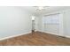 Bedroom with wood floors, a closet and a window for natural light at 7584 Lodge Pole Trl, Winter Park, FL 32792