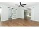 Bedroom with sliding glass doors to the backyard and modern barn door to the bathroom at 7584 Lodge Pole Trl, Winter Park, FL 32792