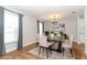 Virtually staged dining room with modern lighting and furniture at 7584 Lodge Pole Trl, Winter Park, FL 32792