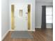 Elegant white front door with decorative glass panels and wood flooring at 7584 Lodge Pole Trl, Winter Park, FL 32792
