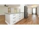 Bright kitchen with a center island that faces an open-concept living area at 7584 Lodge Pole Trl, Winter Park, FL 32792
