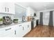 Well-lit kitchen with stainless steel appliances and granite countertops at 7584 Lodge Pole Trl, Winter Park, FL 32792