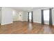 Open living space with wood-look floors and freshly painted walls at 7584 Lodge Pole Trl, Winter Park, FL 32792