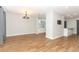 Open living area with hardwood floors and modern light fixtures at 7584 Lodge Pole Trl, Winter Park, FL 32792