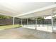 Covered patio overlooking a screened-in pool and green backyard at 7584 Lodge Pole Trl, Winter Park, FL 32792