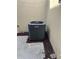 View of the Goodman AC Unit situated on a concrete pad surrounded by mulch at 106 Madrid Dr, Casselberry, FL 32707