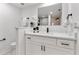 Bright bathroom featuring white vanity with modern fixtures, and a decorative mirror at 106 Madrid Dr, Casselberry, FL 32707
