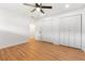 Bedroom featuring hardwood floors, closet, and a ceiling fan at 106 Madrid Dr, Casselberry, FL 32707