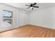 Bedroom with laminate flooring, a window providing natural light and a ceiling fan at 106 Madrid Dr, Casselberry, FL 32707