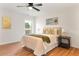 Comfortable bedroom featuring a ceiling fan, a stylish bed and a window with natural light at 106 Madrid Dr, Casselberry, FL 32707