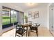 Bright dining area with modern furnishings and sliding glass doors leading to the patio at 106 Madrid Dr, Casselberry, FL 32707