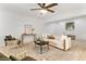 Comfortable living room with a ceiling fan, modern decor, and natural light, perfect for relaxation at 106 Madrid Dr, Casselberry, FL 32707