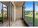 Screened patio featuring sliding glass doors and a view of the lawn at 106 Madrid Dr, Casselberry, FL 32707